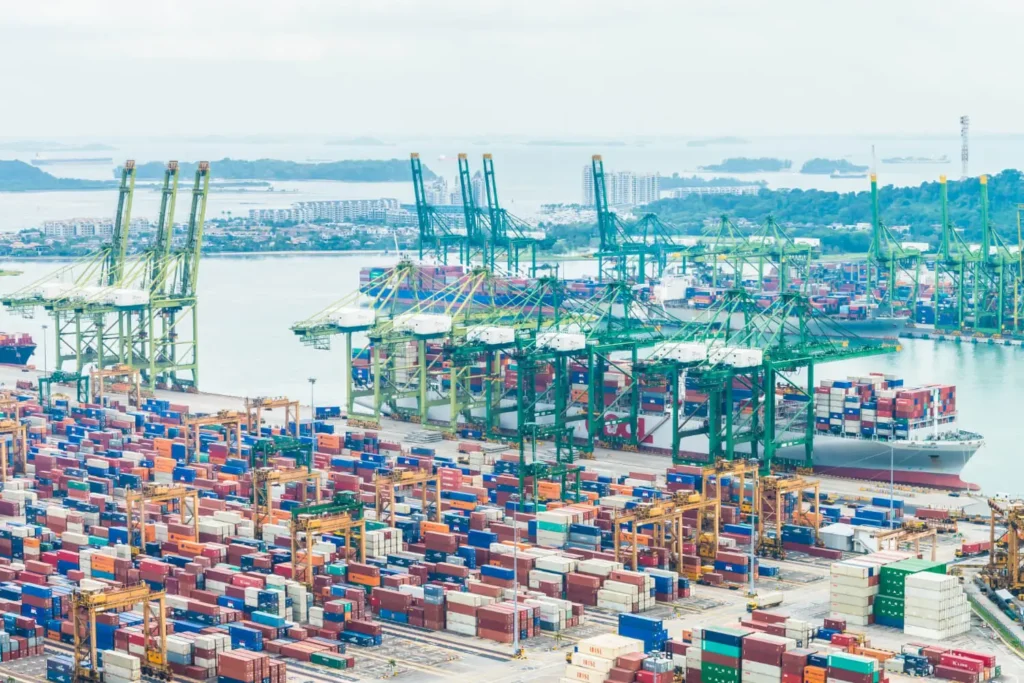 A picture of a port filed with shipping containers.